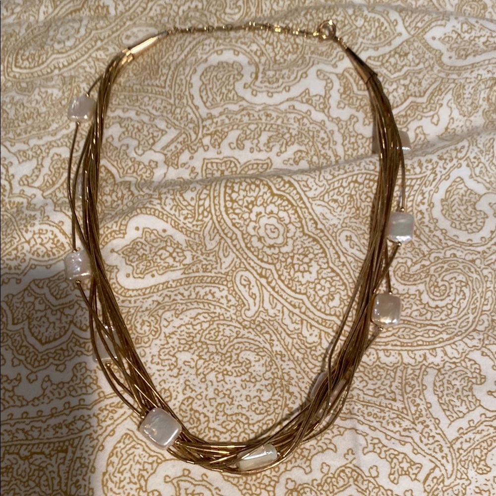 Pretty gold multi stranded necklace with mother of Pearl stones